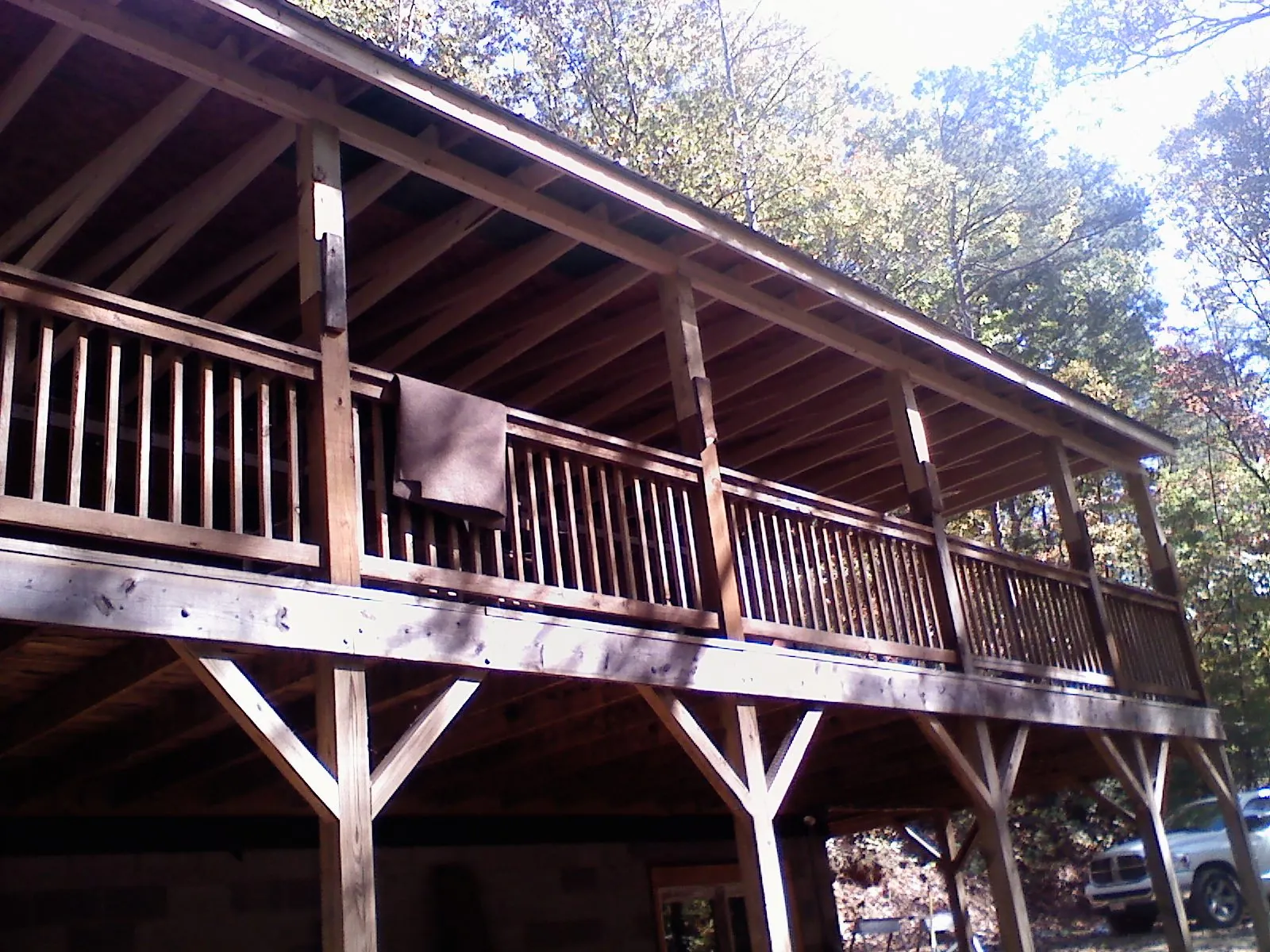 Timber framing under a new elevated porch and deck — Roof Leak Repair in Holcomb by Roofing Brothers